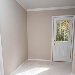 A room with beige walls.