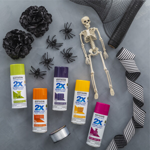 5 cans of Rust-Oleum 2X Ultra Cover Spray Paint, plastic skeleton and plastic spiders.
