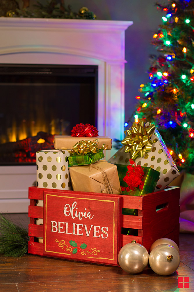 Wood crate painted red with personalized plaque.