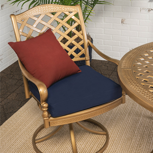 Patio chair with a blue cushion and red pillow.