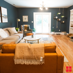 A living room with dark blue walls.