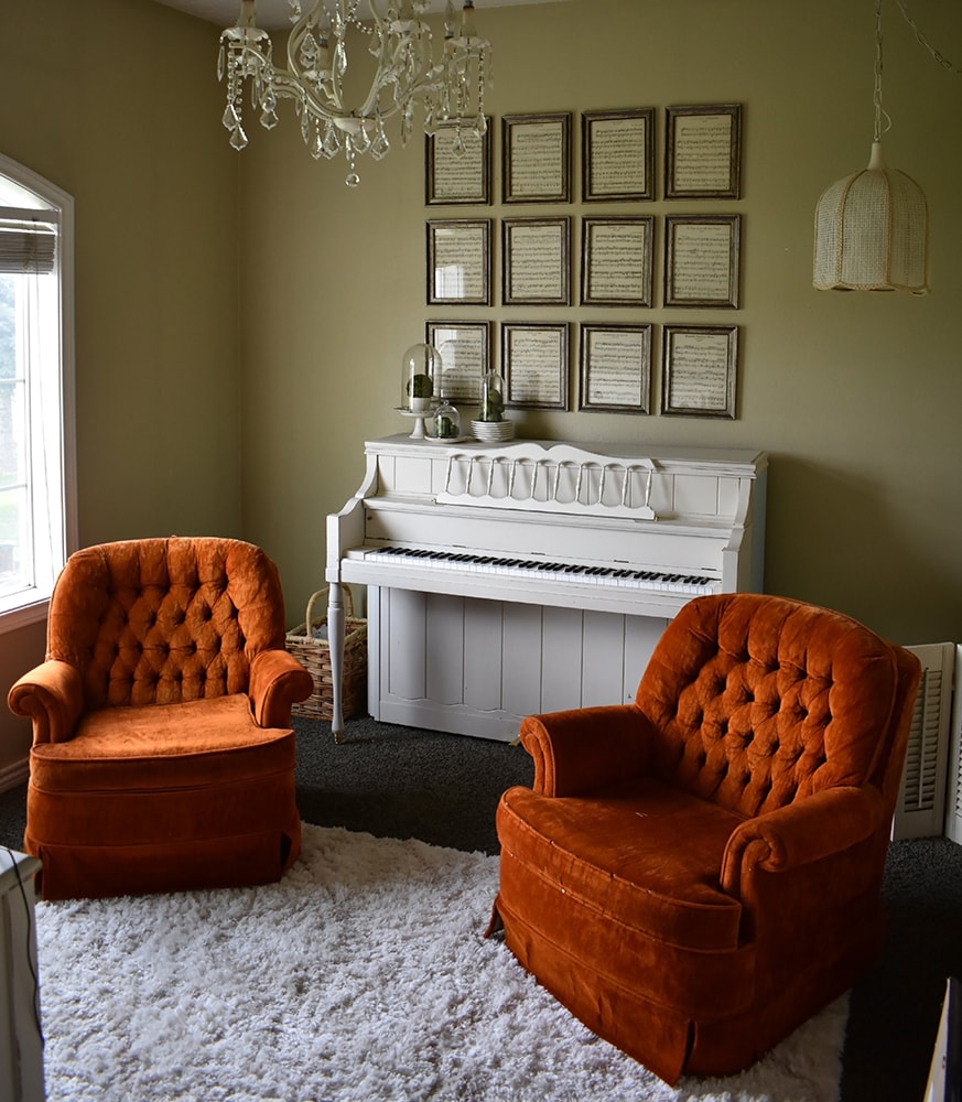 White piano in a living room.