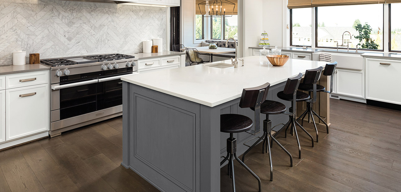 Gray and white kitchen with an island and seating large