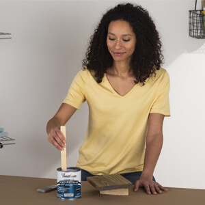 Stirring Can Of Varathane Ultimate Polyurethane 