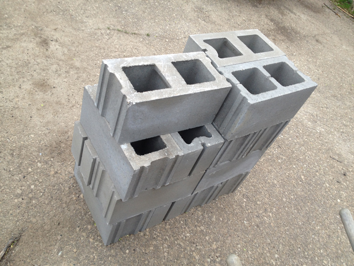 Stack of unpainted cinderblocks.