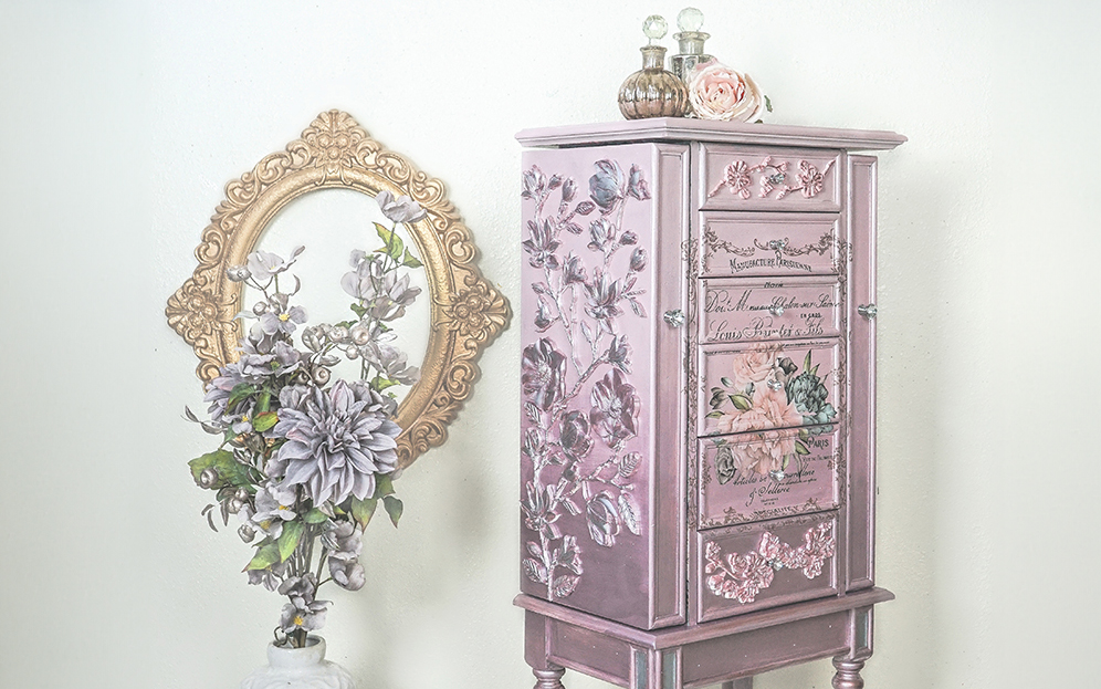 Jewelry armoire painted in different metallic paint shades.