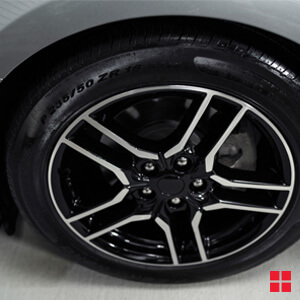 Tire with shiny rubber after Wipe New is applied.