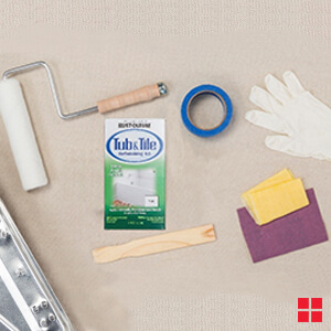 A paint roller, painter’s tape, stir stick, plastic gloves, cloths and a Rust-Oleum Tub & Tile Refinishing Kit.