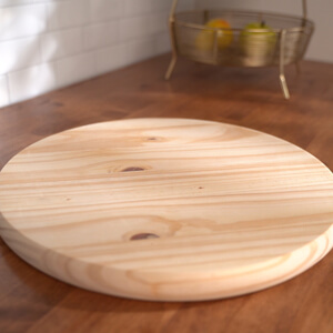 Unstained wood round.