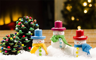 Three wood painted snowmen. 