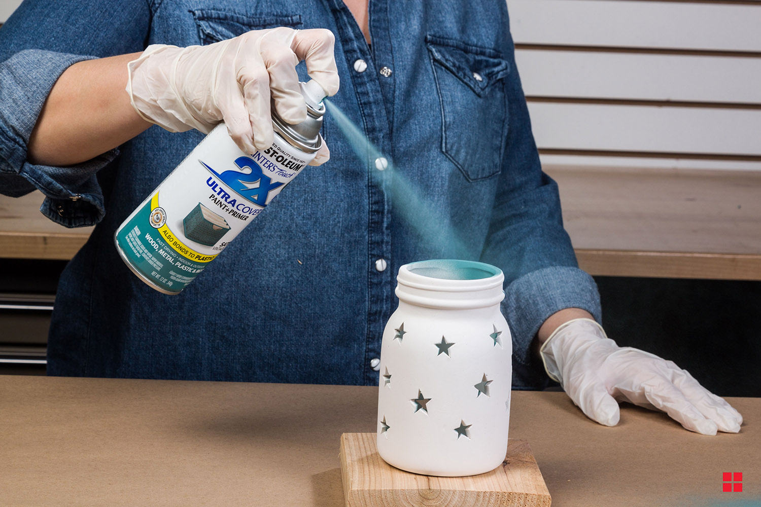 Rust-Oleum Painter’s Touch Ultra 2X Paint + Primer being sprayed on a star jar